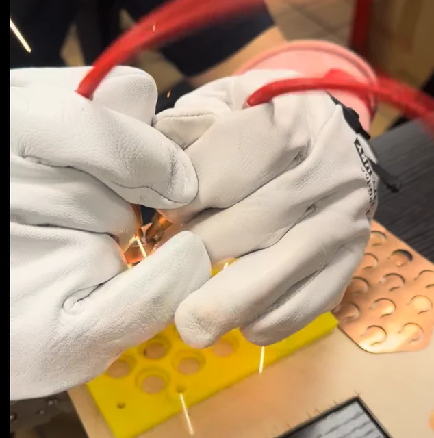 Spot welding the prototype busbar connections.