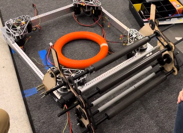 Physical collector prototype with a foam NOTE on the robot chassis.