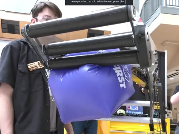 Collector prototype holding an inflatable cube.
